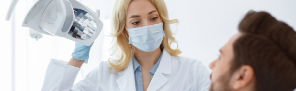 OPIS PRZYPADKU. Ponowne jednowizytowe leczenie endodontyczne drugiego zęba trzonowego żuchwy z rozległym zapaleniem okołokorzeniowym. Opis przypadku – Mariusz Lipski, Łukasz Połudzień
